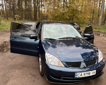 Синий Мицубиси Лансер, объемом двигателя 1.6 л и пробегом 150 тыс. км за 5700 $, фото 25 на Automoto.ua