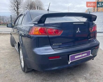 Синий Мицубиси Лансер, объемом двигателя 2 л и пробегом 142 тыс. км за 8000 $, фото 7 на Automoto.ua