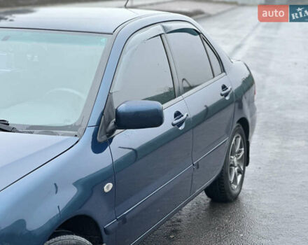 Синий Мицубиси Лансер, объемом двигателя 1.6 л и пробегом 187 тыс. км за 3799 $, фото 7 на Automoto.ua