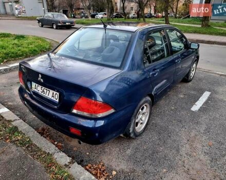Синій Міцубісі Lancer, об'ємом двигуна 1.6 л та пробігом 298 тис. км за 2998 $, фото 4 на Automoto.ua