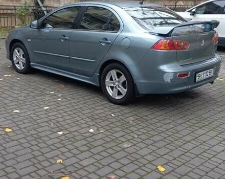 Синий Мицубиси Лансер, объемом двигателя 2 л и пробегом 300 тыс. км за 6900 $, фото 6 на Automoto.ua