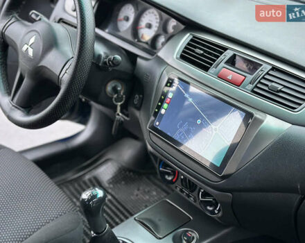 Синий Мицубиси Лансер, объемом двигателя 1.6 л и пробегом 187 тыс. км за 3799 $, фото 20 на Automoto.ua