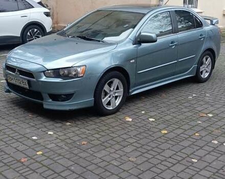 Синий Мицубиси Лансер, объемом двигателя 2 л и пробегом 300 тыс. км за 6900 $, фото 3 на Automoto.ua