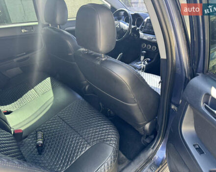 Синий Мицубиси Лансер, объемом двигателя 2 л и пробегом 299 тыс. км за 7100 $, фото 10 на Automoto.ua