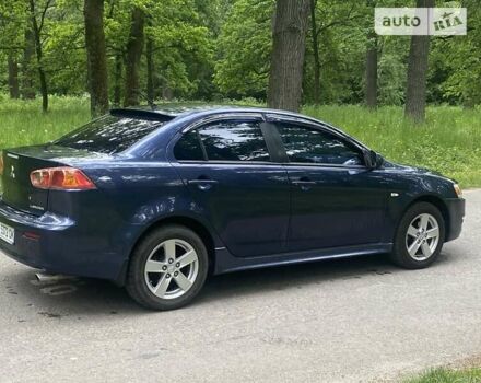 Синій Міцубісі Lancer, об'ємом двигуна 2 л та пробігом 130 тис. км за 7800 $, фото 3 на Automoto.ua