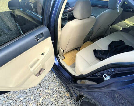 Синий Мицубиси Лансер, объемом двигателя 1.5 л и пробегом 241 тыс. км за 6500 $, фото 3 на Automoto.ua