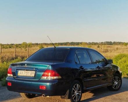 Синий Мицубиси Лансер, объемом двигателя 1.6 л и пробегом 197 тыс. км за 6500 $, фото 3 на Automoto.ua