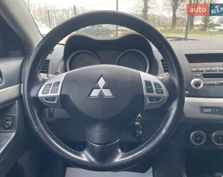 Синий Мицубиси Лансер, объемом двигателя 2 л и пробегом 142 тыс. км за 8000 $, фото 26 на Automoto.ua