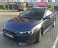 Синий Мицубиси Лансер, объемом двигателя 2 л и пробегом 142 тыс. км за 8000 $, фото 1 на Automoto.ua