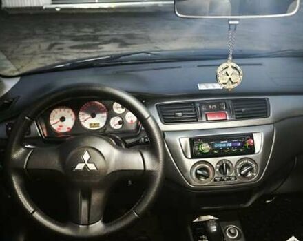 Синій Міцубісі Lancer, об'ємом двигуна 1.6 л та пробігом 206 тис. км за 5500 $, фото 12 на Automoto.ua
