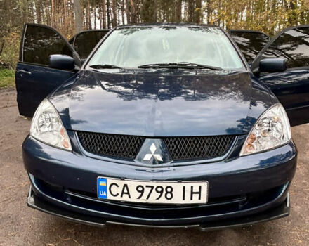 Синий Мицубиси Лансер, объемом двигателя 1.6 л и пробегом 150 тыс. км за 5700 $, фото 26 на Automoto.ua