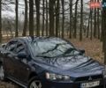 Синий Мицубиси Лансер, объемом двигателя 2 л и пробегом 243 тыс. км за 5800 $, фото 1 на Automoto.ua