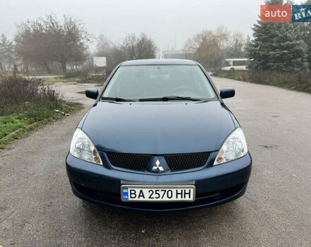Синий Мицубиси Лансер, объемом двигателя 1.59 л и пробегом 126 тыс. км за 5950 $, фото 1 на Automoto.ua