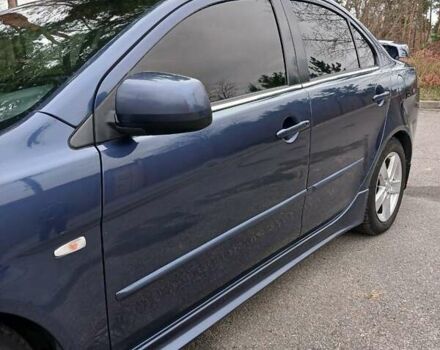 Синий Мицубиси Лансер, объемом двигателя 1.5 л и пробегом 220 тыс. км за 6999 $, фото 26 на Automoto.ua