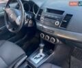 Синий Мицубиси Лансер, объемом двигателя 2 л и пробегом 250 тыс. км за 6100 $, фото 13 на Automoto.ua