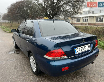 Синий Мицубиси Лансер, объемом двигателя 1.59 л и пробегом 126 тыс. км за 5950 $, фото 4 на Automoto.ua