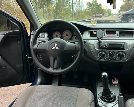 Синий Мицубиси Лансер, объемом двигателя 1.6 л и пробегом 150 тыс. км за 5700 $, фото 42 на Automoto.ua