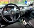 Синий Мицубиси Лансер, объемом двигателя 1.6 л и пробегом 215 тыс. км за 5200 $, фото 8 на Automoto.ua