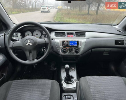 Синий Мицубиси Лансер, объемом двигателя 1.59 л и пробегом 126 тыс. км за 5950 $, фото 10 на Automoto.ua