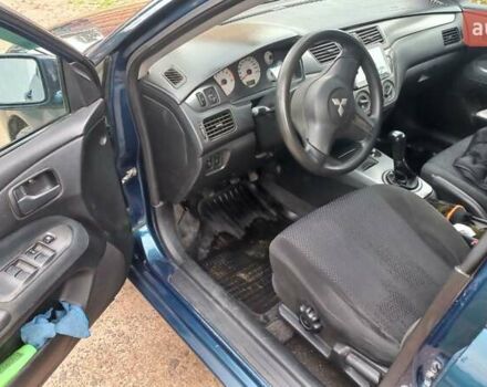 Синій Міцубісі Lancer, об'ємом двигуна 1.58 л та пробігом 220 тис. км за 4200 $, фото 13 на Automoto.ua