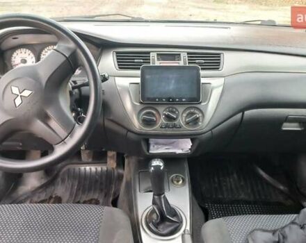 Синій Міцубісі Lancer, об'ємом двигуна 1.58 л та пробігом 220 тис. км за 4200 $, фото 12 на Automoto.ua