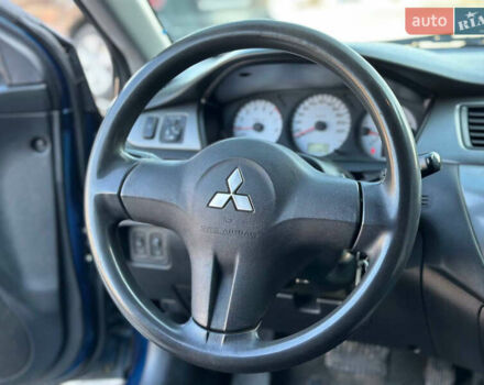 Синій Міцубісі Lancer, об'ємом двигуна 1.6 л та пробігом 250 тис. км за 5499 $, фото 15 на Automoto.ua