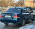 Синій Міцубісі Lancer, об'ємом двигуна 1.6 л та пробігом 250 тис. км за 5499 $, фото 6 на Automoto.ua