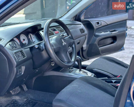 Синій Міцубісі Lancer, об'ємом двигуна 1.6 л та пробігом 250 тис. км за 5499 $, фото 10 на Automoto.ua