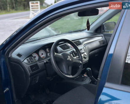 Синий Мицубиси Лансер, объемом двигателя 1.58 л и пробегом 134 тыс. км за 5100 $, фото 31 на Automoto.ua