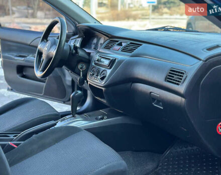 Синій Міцубісі Lancer, об'ємом двигуна 1.6 л та пробігом 250 тис. км за 5499 $, фото 13 на Automoto.ua
