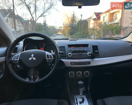 Синий Мицубиси Лансер, объемом двигателя 2 л и пробегом 320 тыс. км за 4999 $, фото 6 на Automoto.ua