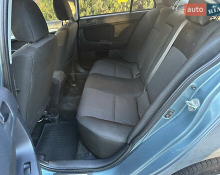 Синий Мицубиси Лансер, объемом двигателя 2 л и пробегом 320 тыс. км за 4999 $, фото 8 на Automoto.ua