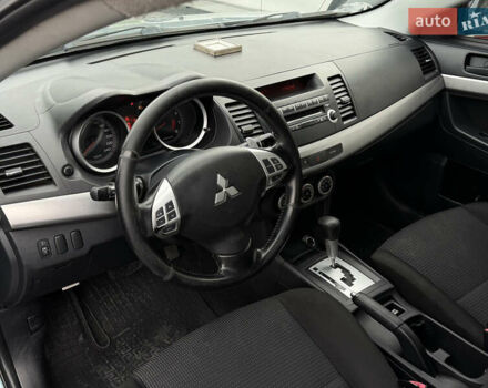 Синий Мицубиси Лансер, объемом двигателя 2 л и пробегом 320 тыс. км за 4900 $, фото 8 на Automoto.ua