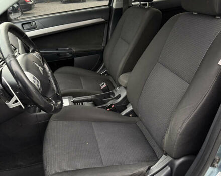 Синий Мицубиси Лансер, объемом двигателя 2 л и пробегом 320 тыс. км за 4900 $, фото 6 на Automoto.ua