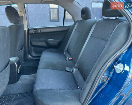 Синій Міцубісі Lancer, об'ємом двигуна 1.6 л та пробігом 250 тис. км за 5499 $, фото 20 на Automoto.ua