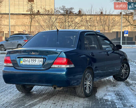 Синій Міцубісі Lancer, об'ємом двигуна 1.6 л та пробігом 250 тис. км за 5499 $, фото 8 на Automoto.ua