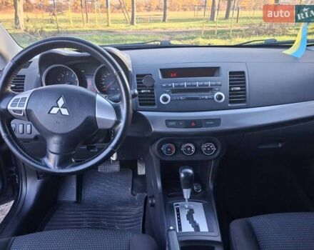 Синий Мицубиси Лансер, объемом двигателя 1.5 л и пробегом 123 тыс. км за 8500 $, фото 6 на Automoto.ua