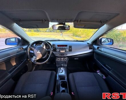 Синий Мицубиси Лансер, объемом двигателя 2 л и пробегом 261 тыс. км за 7300 $, фото 4 на Automoto.ua