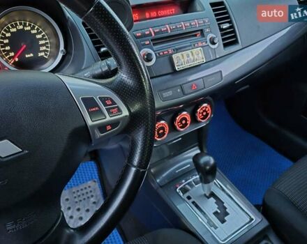 Синий Мицубиси Лансер, объемом двигателя 2 л и пробегом 250 тыс. км за 7699 $, фото 35 на Automoto.ua
