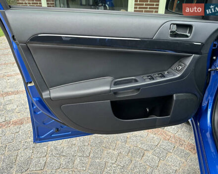 Синий Мицубиси Лансер, объемом двигателя 1.6 л и пробегом 37 тыс. км за 10999 $, фото 12 на Automoto.ua