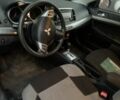 Синий Мицубиси Лансер, объемом двигателя 2 л и пробегом 157 тыс. км за 6670 $, фото 6 на Automoto.ua