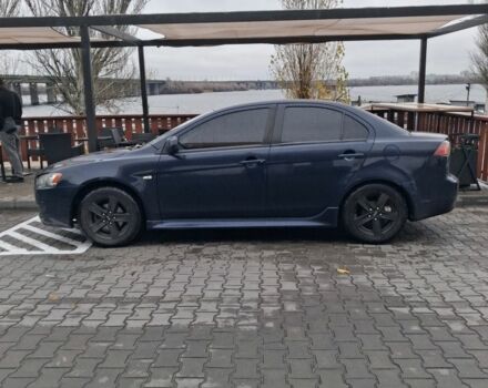 Синий Мицубиси Лансер, объемом двигателя 2 л и пробегом 233 тыс. км за 7000 $, фото 2 на Automoto.ua