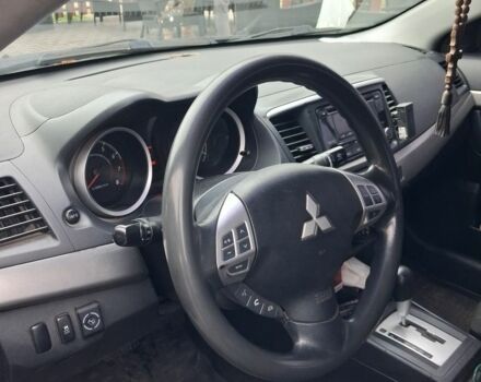 Синий Мицубиси Лансер, объемом двигателя 2 л и пробегом 233 тыс. км за 7000 $, фото 5 на Automoto.ua