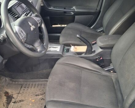 Синий Мицубиси Лансер, объемом двигателя 2 л и пробегом 233 тыс. км за 7000 $, фото 6 на Automoto.ua