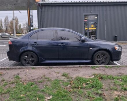 Синий Мицубиси Лансер, объемом двигателя 2 л и пробегом 233 тыс. км за 7000 $, фото 3 на Automoto.ua