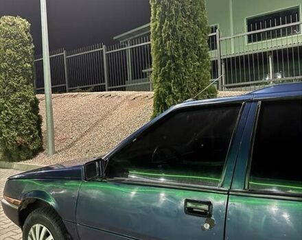 Синий Мицубиси Лансер, объемом двигателя 1.5 л и пробегом 170 тыс. км за 650 $, фото 7 на Automoto.ua