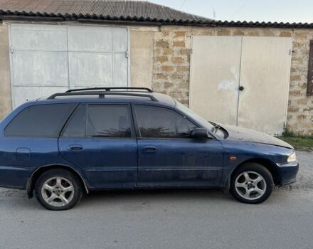 Синий Мицубиси Лансер, объемом двигателя 1.6 л и пробегом 999 тыс. км за 594 $, фото 11 на Automoto.ua