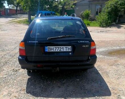 Синий Мицубиси Лансер, объемом двигателя 1.6 л и пробегом 225 тыс. км за 1100 $, фото 1 на Automoto.ua