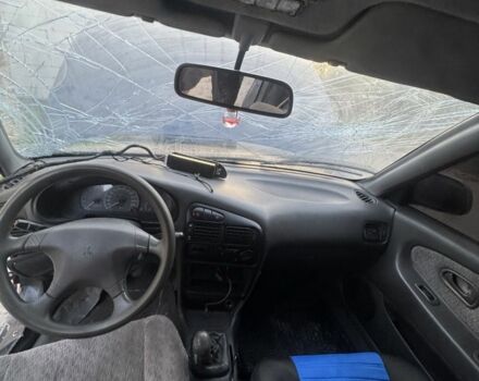 Синий Мицубиси Лансер, объемом двигателя 1.6 л и пробегом 999 тыс. км за 594 $, фото 18 на Automoto.ua