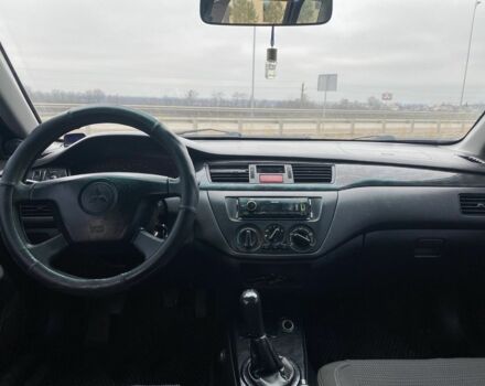 Синий Мицубиси Лансер, объемом двигателя 1.6 л и пробегом 240 тыс. км за 2600 $, фото 6 на Automoto.ua